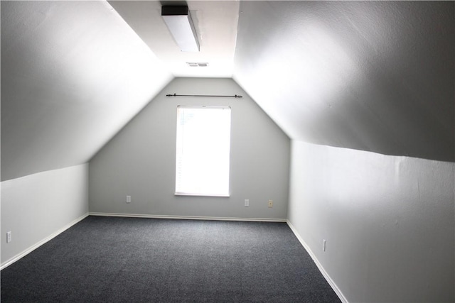 bonus room featuring carpet flooring and vaulted ceiling