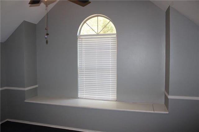 bonus room with ceiling fan and lofted ceiling