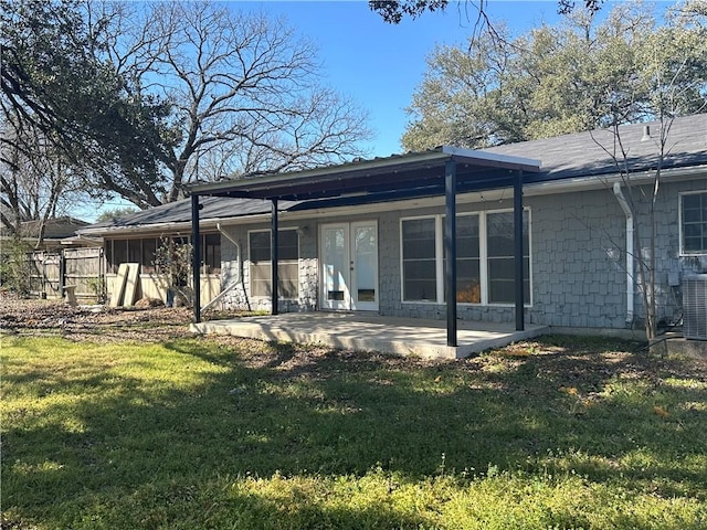 rear view of house with a yard, a patio, fence, and central air condition unit