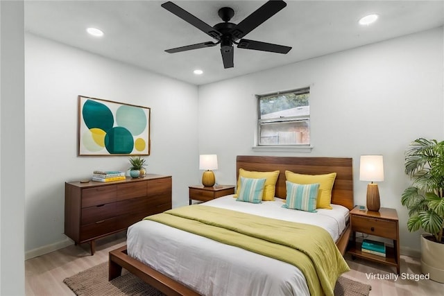 bedroom featuring light hardwood / wood-style floors and ceiling fan