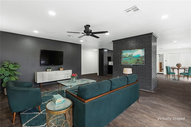 living room with dark hardwood / wood-style floors and ceiling fan