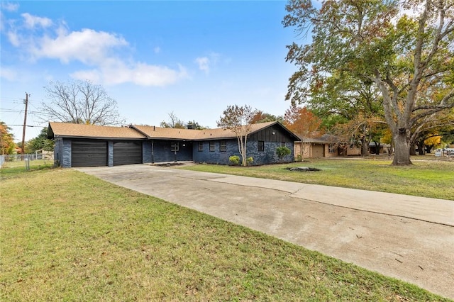 ranch-style house with a garage and a front lawn