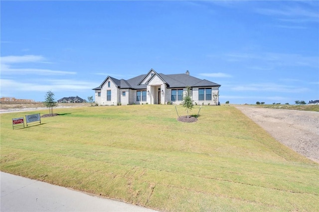 view of front of home with a front lawn