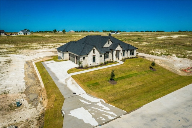 view of front of home featuring a rural view and a garage