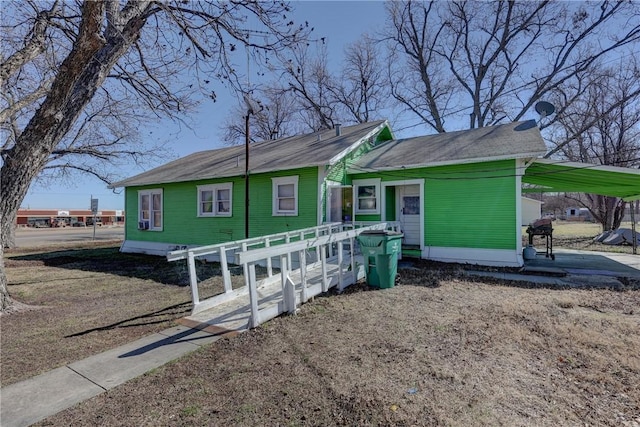 view of front of home with a carport