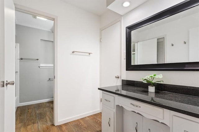 bathroom featuring hardwood / wood-style floors and vanity