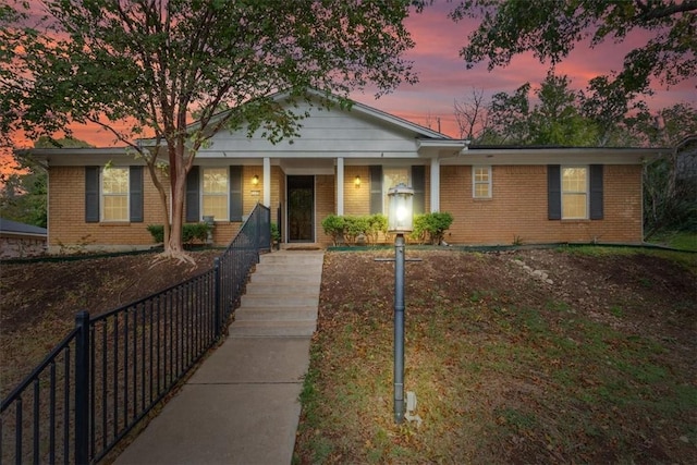 ranch-style house featuring a porch