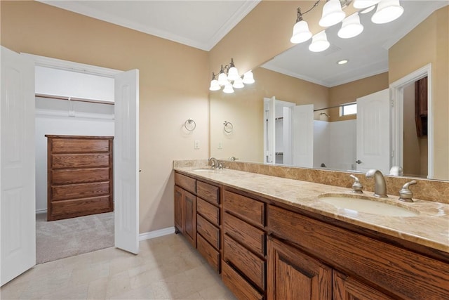 bathroom featuring vanity, ornamental molding, and a notable chandelier