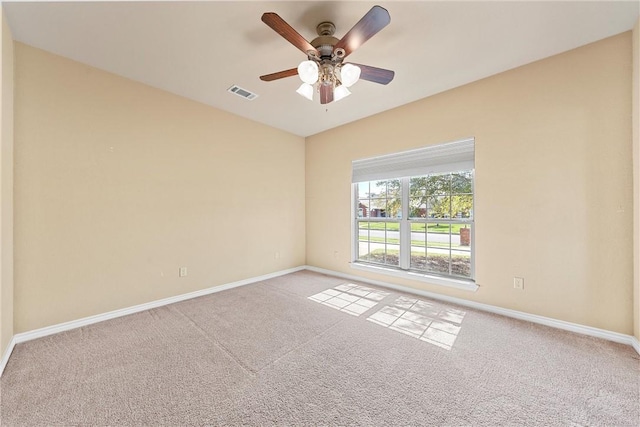 unfurnished room featuring ceiling fan and light colored carpet