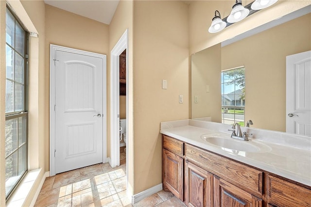 bathroom with vanity and toilet