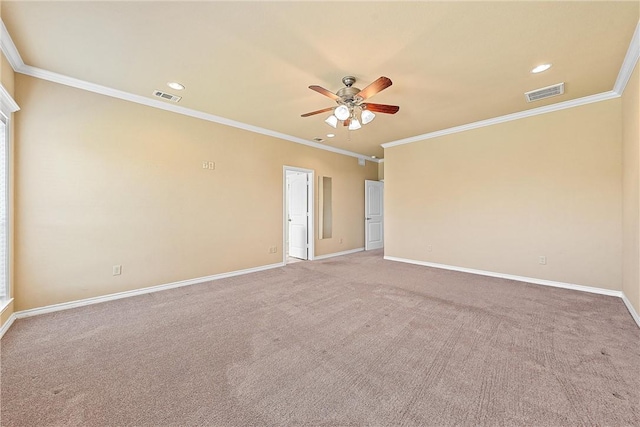 empty room featuring carpet flooring, ceiling fan, and ornamental molding