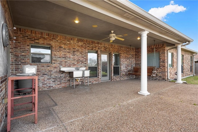 view of patio featuring ceiling fan