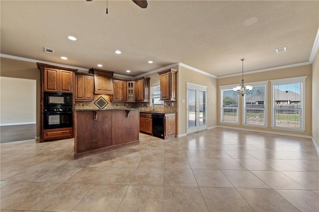 kitchen featuring decorative backsplash, crown molding, a breakfast bar, and black appliances