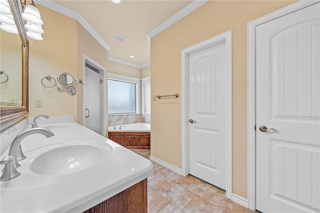 bathroom featuring a tub, vanity, and ornamental molding