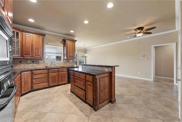 kitchen with backsplash, ornamental molding, sink, black appliances, and pendant lighting