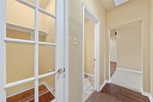 hall with hardwood / wood-style flooring