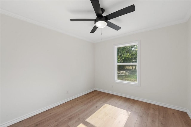 spare room with ceiling fan, light hardwood / wood-style floors, and crown molding