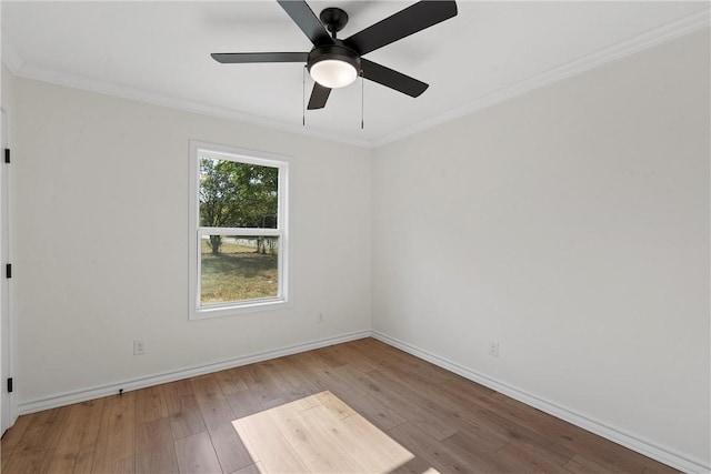 empty room featuring ceiling fan, light hardwood / wood-style floors, and ornamental molding