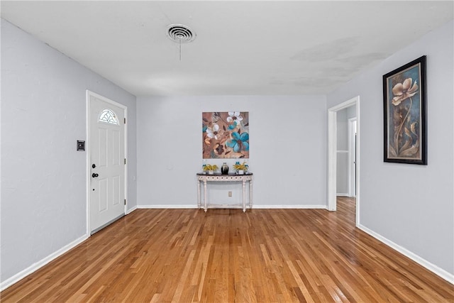 foyer entrance featuring wood-type flooring