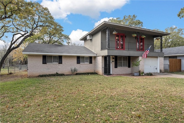 view of front of house with a wall mounted AC, a balcony, a garage, and a front lawn