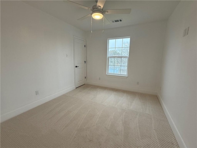 empty room with light carpet and ceiling fan