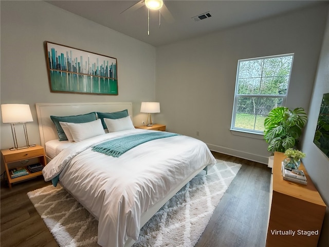 bedroom featuring dark wood-type flooring and ceiling fan