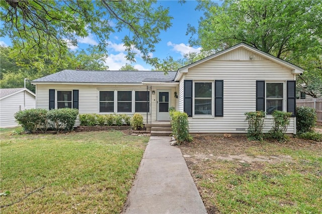 single story home featuring a front lawn