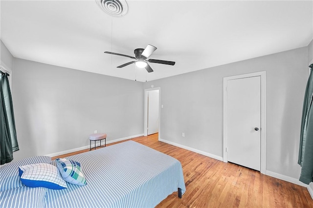 bedroom featuring ceiling fan and light hardwood / wood-style floors