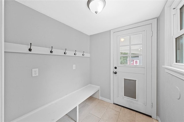 mudroom with light tile patterned floors