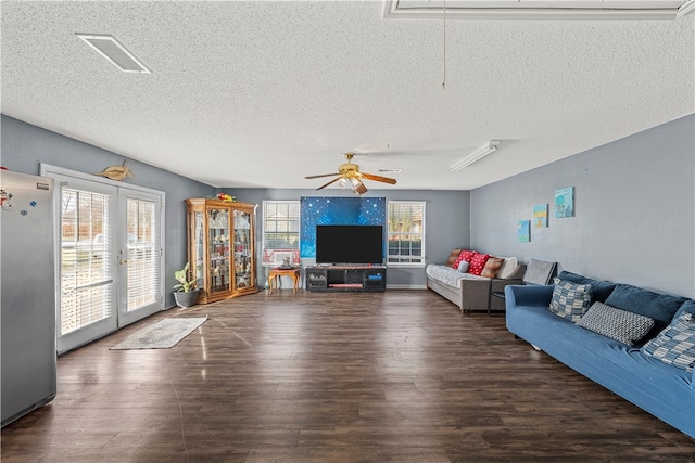 living room featuring french doors, a textured ceiling, ceiling fan, and plenty of natural light