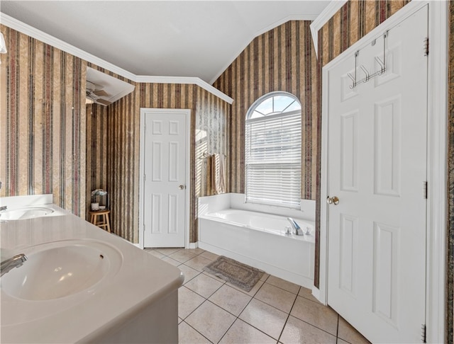 bathroom with a bath, vanity, tile patterned floors, ceiling fan, and ornamental molding