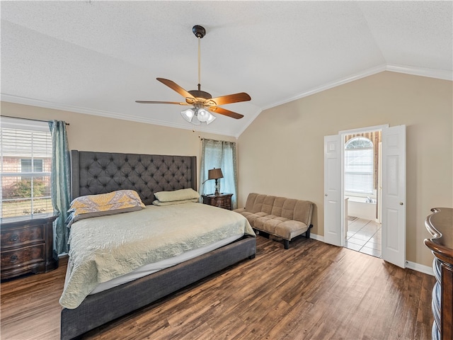 bedroom with vaulted ceiling, ceiling fan, crown molding, and wood-type flooring