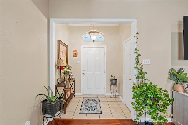 foyer entrance featuring light tile patterned flooring