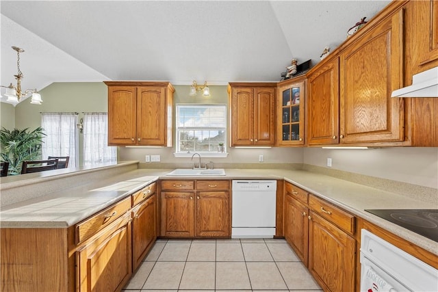 kitchen featuring sink, an inviting chandelier, lofted ceiling, white appliances, and pendant lighting