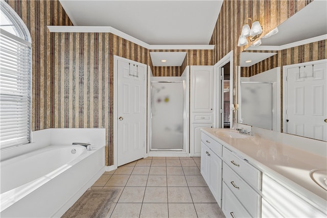 bathroom with independent shower and bath, tile patterned flooring, and vanity