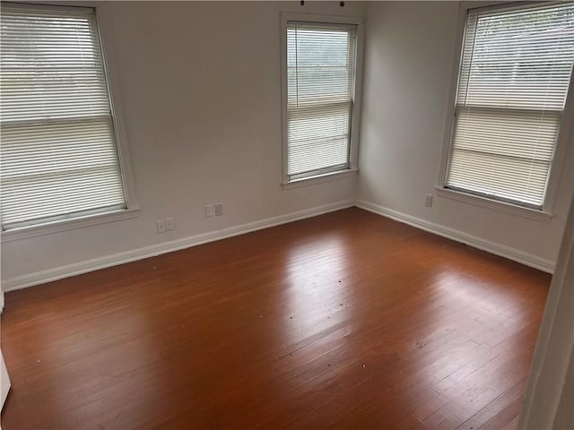 empty room with wood-type flooring