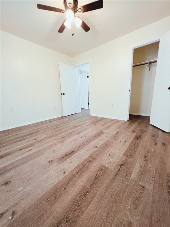 unfurnished bedroom with light wood-type flooring, a closet, and ceiling fan