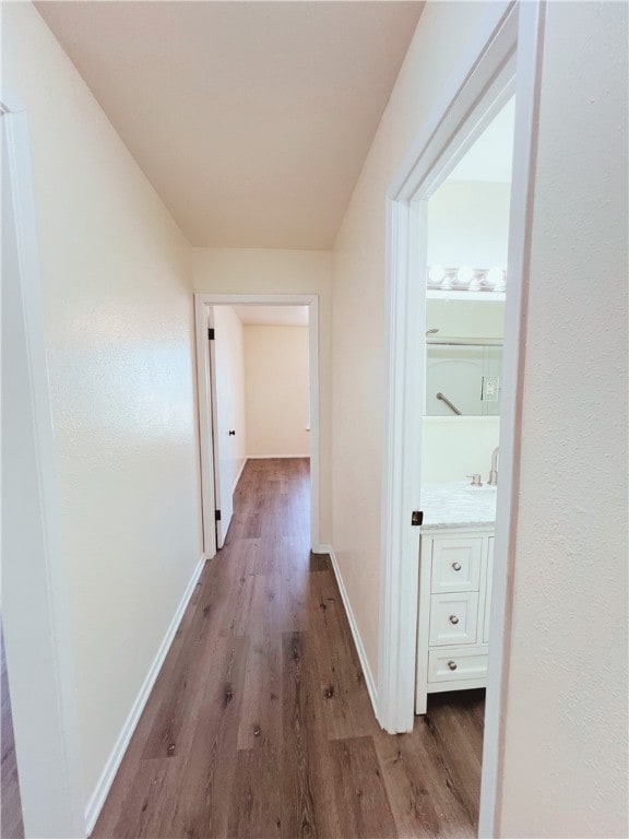 hall with hardwood / wood-style floors