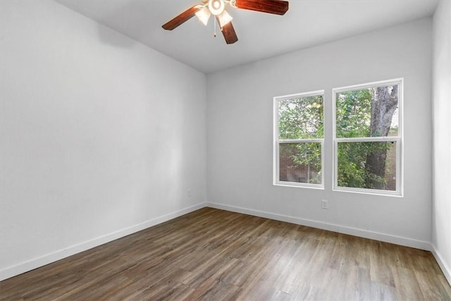 spare room featuring ceiling fan and wood-type flooring