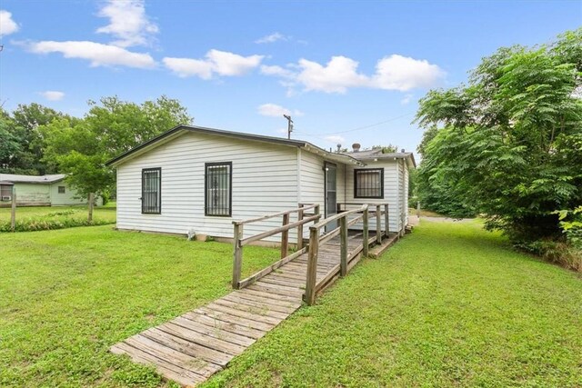 exterior space featuring a front lawn