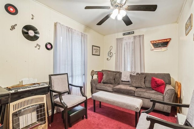 carpeted living room featuring ceiling fan and heating unit