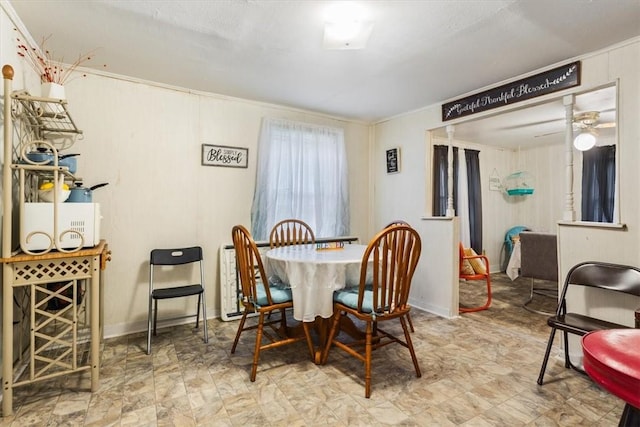 dining space with ceiling fan