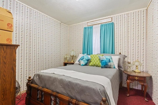 bedroom featuring carpet flooring and a textured ceiling