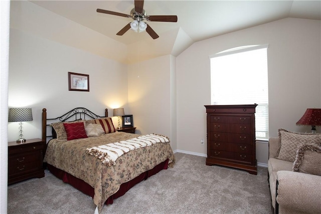 bedroom with ceiling fan, light colored carpet, and lofted ceiling