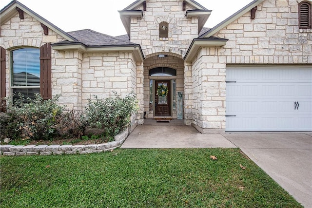 property entrance with a lawn