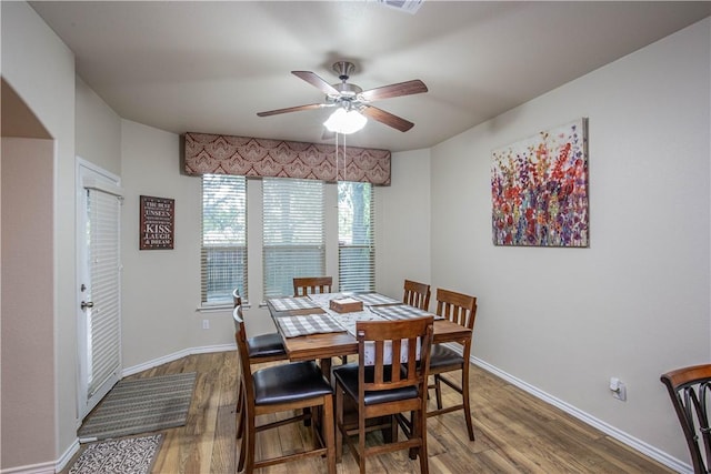 dining space featuring hardwood / wood-style flooring and ceiling fan