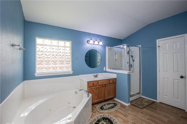 bathroom with vanity, separate shower and tub, wood-type flooring, and lofted ceiling