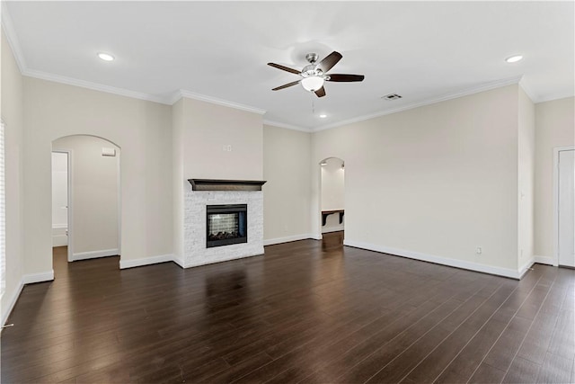 unfurnished living room with a fireplace, dark hardwood / wood-style flooring, and ornamental molding