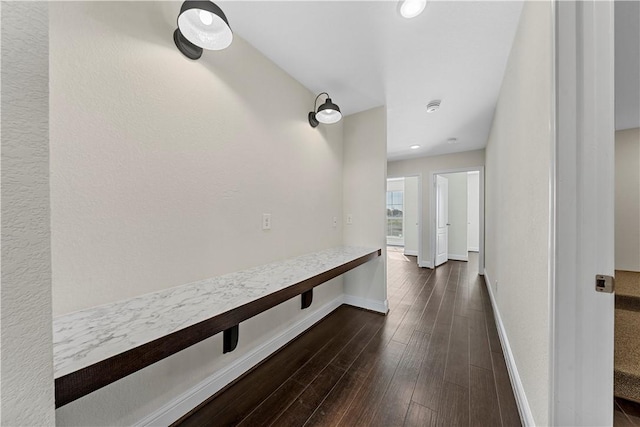 hallway with dark wood-type flooring