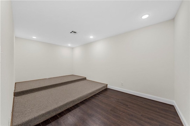 basement with dark wood-type flooring